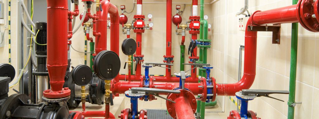 A room full of fire sprinkler piping and valves